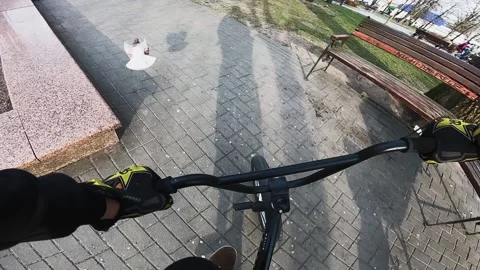 A guy performs a trick on a bicycle, jumps down the stairs Stock Footage 195558494