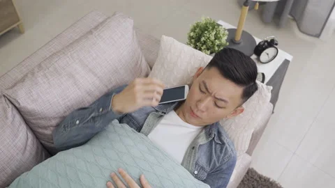 Guy is picking up his dropping smartphone Stock Footage 163893230
