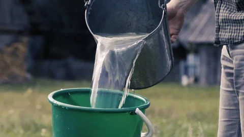 The guy is picking up water in the well Stock Footage 100158348