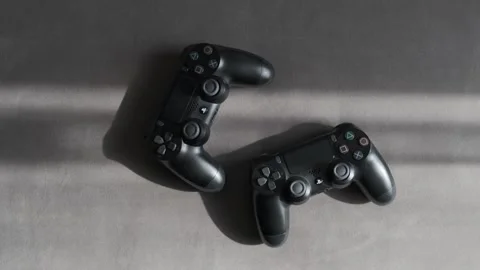 The guy picks up a gaming console for a PlayStation Stock Footage 263725479