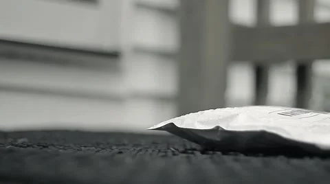 Guy Picks Up Package In Rain And Then Goes Back Inside Stock-Footage 52084823