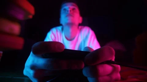 Guy play retro console,focus on the hand,Angry gamer Stock Footage 126094476