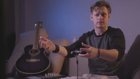 The guy is playing a computer game Stock Footage 118857819