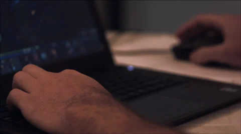 A guy playing at the computer at night. Stock Footage 37539070