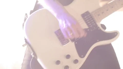 The guy playing the electric guitar.Close-up Stock Footage 75913189
