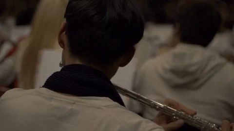 Guy playing flute in a orchestra Stock Footage 86016102