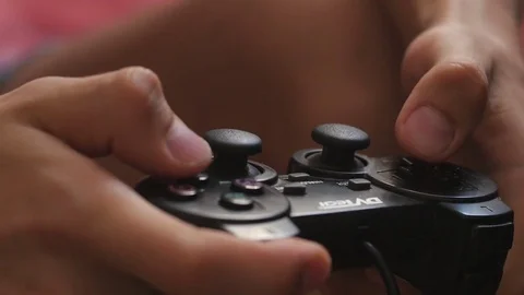 The guy is playing on the gamepad. close-up Stock Footage 81321594
