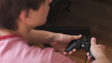 The guy is playing on the gamepad. close-up Stock Footage 81321633