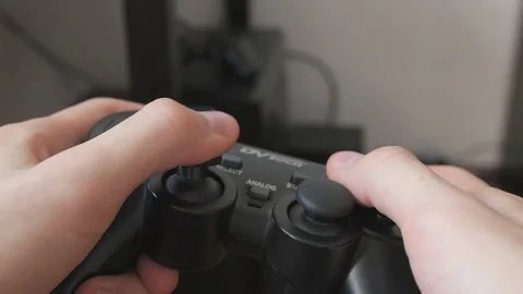 The guy is playing on the gamepad. close-up Stock Footage 81322709