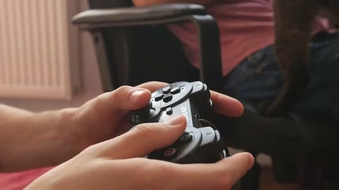 The guy is playing on the gamepad. close-up Stock Footage 81323090