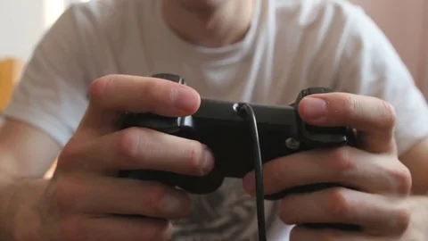 The guy is playing on the gamepad. close-up Stock Footage 81323098