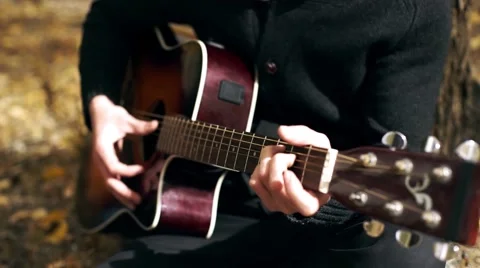 The guy is playing guitar Stock Footage 54985236