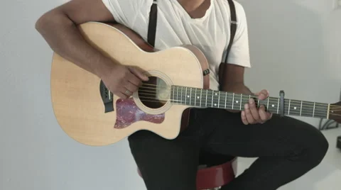 Guy playing guitar Stock Footage 68652572