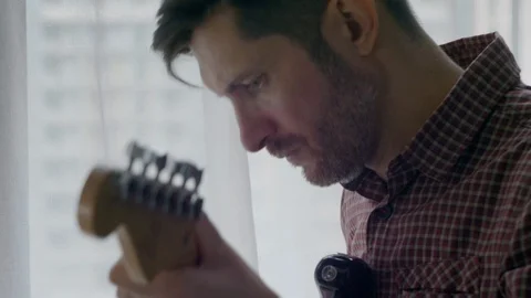 The guy is playing the guitar Stock-Footage 127666967