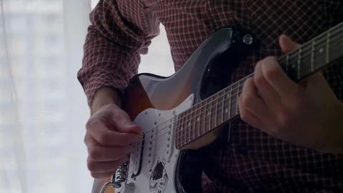 The guy is playing the guitar Stock Footage 127667697