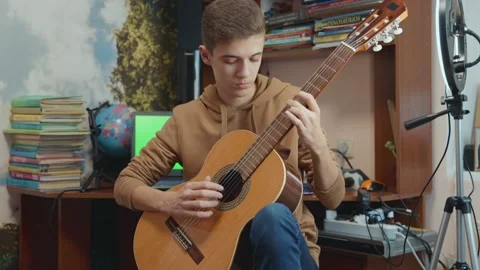 Guy playing guitar Stock Footage 170660159