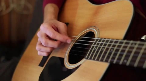 The Guy Playing The Guitar. In the hands of a mediator. Close-up. Stock Footage 59728751