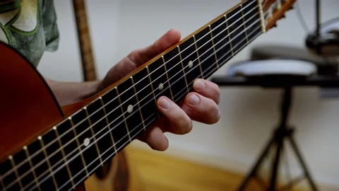 Guy playing guitar slow motion. close up. acoustic Stock Footage 233898367