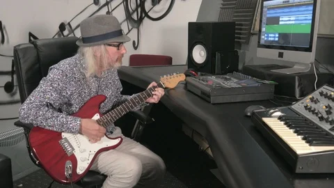 Guy playing guitar in studio. Stock Footage 113484084