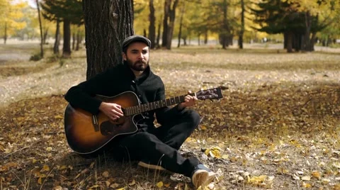 The guy is playing guitar.mp4 Stock Footage 54985249