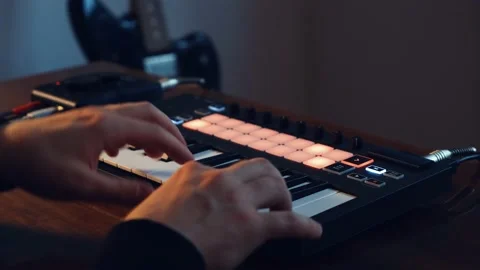 Guy Playing At Home Studio With Digital Midi Keyboard And Audio Interface Stock Footage 131431672