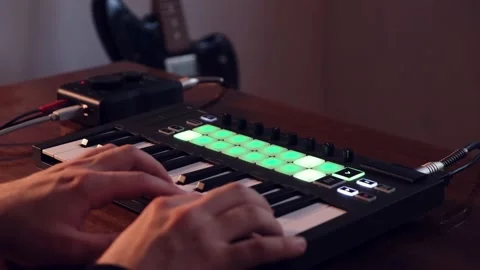 Guy Playing At Home Studio With Digital Midi Keyboard And Audio Interface Stock Footage 131431673