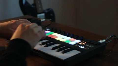 Guy Playing At Home Studio With Digital Midi Keyboard And Audio Interface Stock Footage 131431680