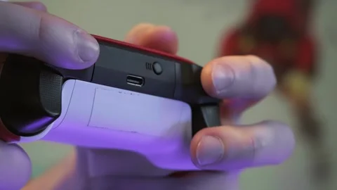 A guy is playing a joystick in front of the TV, a close-up of a joystick Stock Footage 264096283