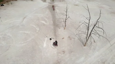 A guy playing music at a DJ console in a chemical wasteland. Stock Footage 172292668