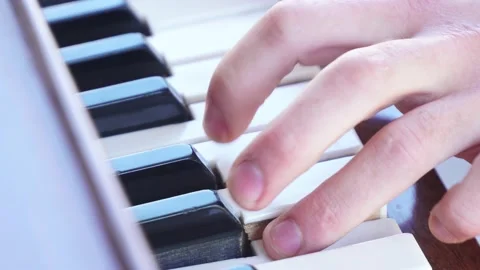 Guy playing the piano.Super close-up Shot.Macro shot finger in piano Stock Footage 163350886