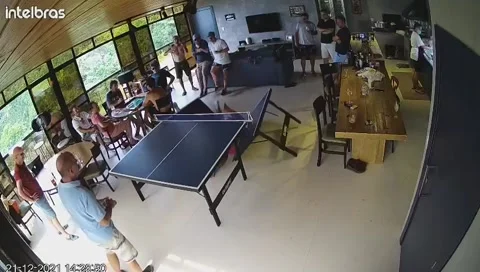 Guy Playing Ping Pong Takes a Dive on the Table, Florianopolis - 01 Oct 2022 Stock Footage 219030796