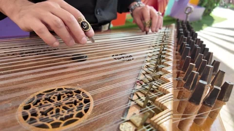 Guy playing on the qanun instrument Middle Eastern music Vídeos de archivo 322664668