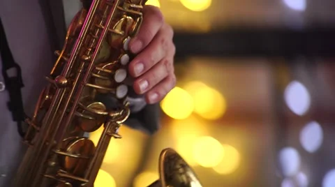 Guy playing the saxophone at the party Stock Footage 55788868