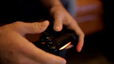 The guy playing the video game joystick Stock Footage 73380652