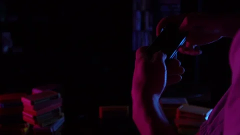 Guy playing video games in dark room by light of television Stock Footage 126094284