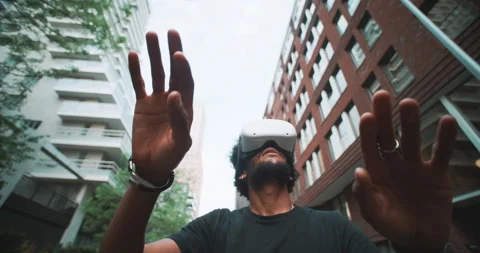 Guy playing with virtual reality in the city Video stock 201684519