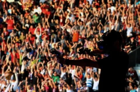 Guy playing with virtual reality headset and hand controls Stock Photos