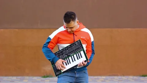 Guy playing wireless synthesizer close-up Stock Footage 251548892
