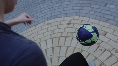 A guy plays with a ball in the Park. Beautiful stunts in the fresh air. Close up Stock Footage 125436151