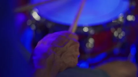 The guy plays the drums, focus with the hands of the drummer on the drum. Close  Stock Footage 200222952