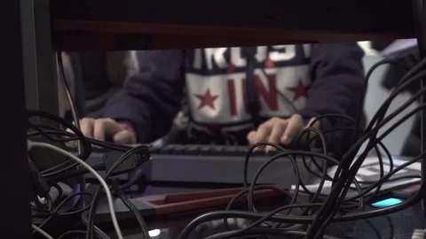 Guy plays a game in a computer club Stock Footage 82584243