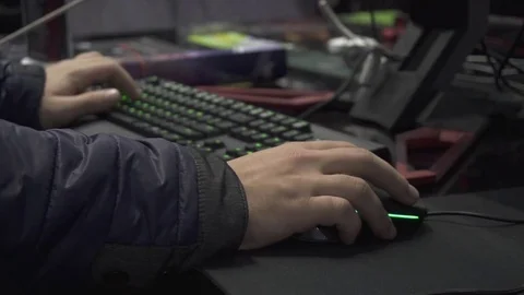 Guy plays a game in a computer club Stock Footage 82584253