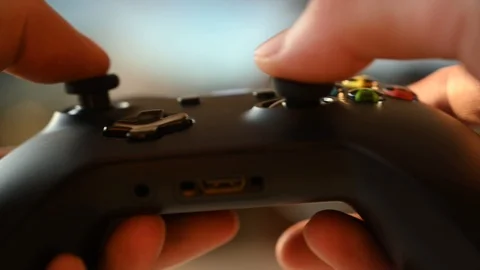 A guy plays a game console Stock Footage 119385588