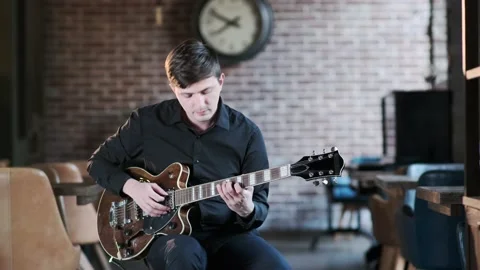 Guy plays the guitar in bar. Blues musical improvisation. Jazz, Blues, Funk Stock Footage 135355608