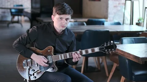 Guy plays the guitar in bar. Blues musical improvisation. Jazz, Blues, Funk Stock Footage 135355677