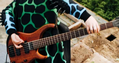 The guy plays the guitar throwing it behind his back. Funny funny shots. Stock Footage 114520245