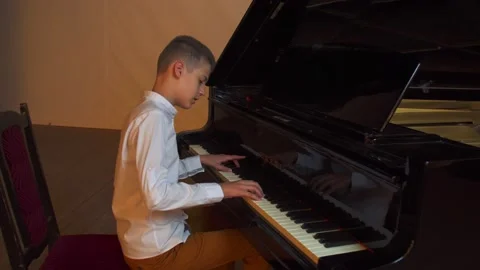 The guy plays the piano Video stock 144866957