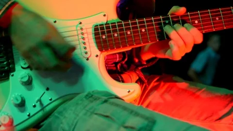 The guy plays a slow guitar solo Stock Footage 73908322