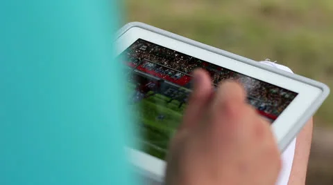 Guy plays on the tablet Stock Footage 25875464