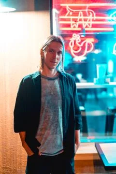 The guy is posing on the camera and looks at the camera Stock Photos